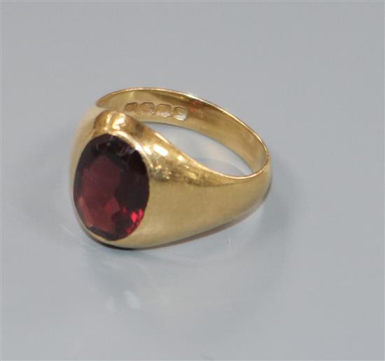 An 18ct gold and red paste set signet ring, size J/K